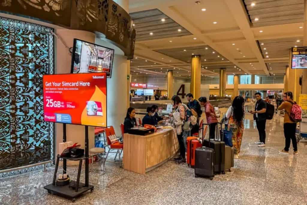 Telkomsel kiosk sells SIM card at Bali Airport