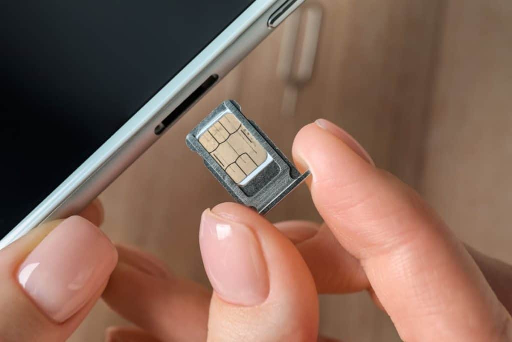 Insert a UK physical SIM card in the designated slot