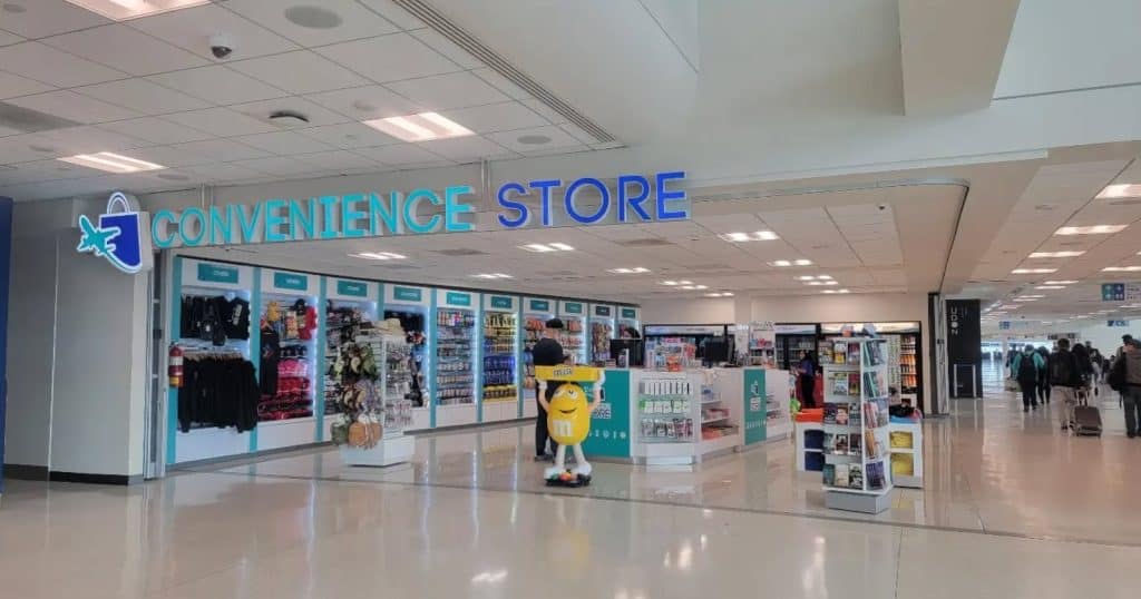 Approach a staff member inside the store and ask about the available plans and pricing for Claro SIM card at Luis Muñoz Marín Airport.
